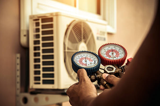 Professional Air Conditioning Service technician working in Chase, MD